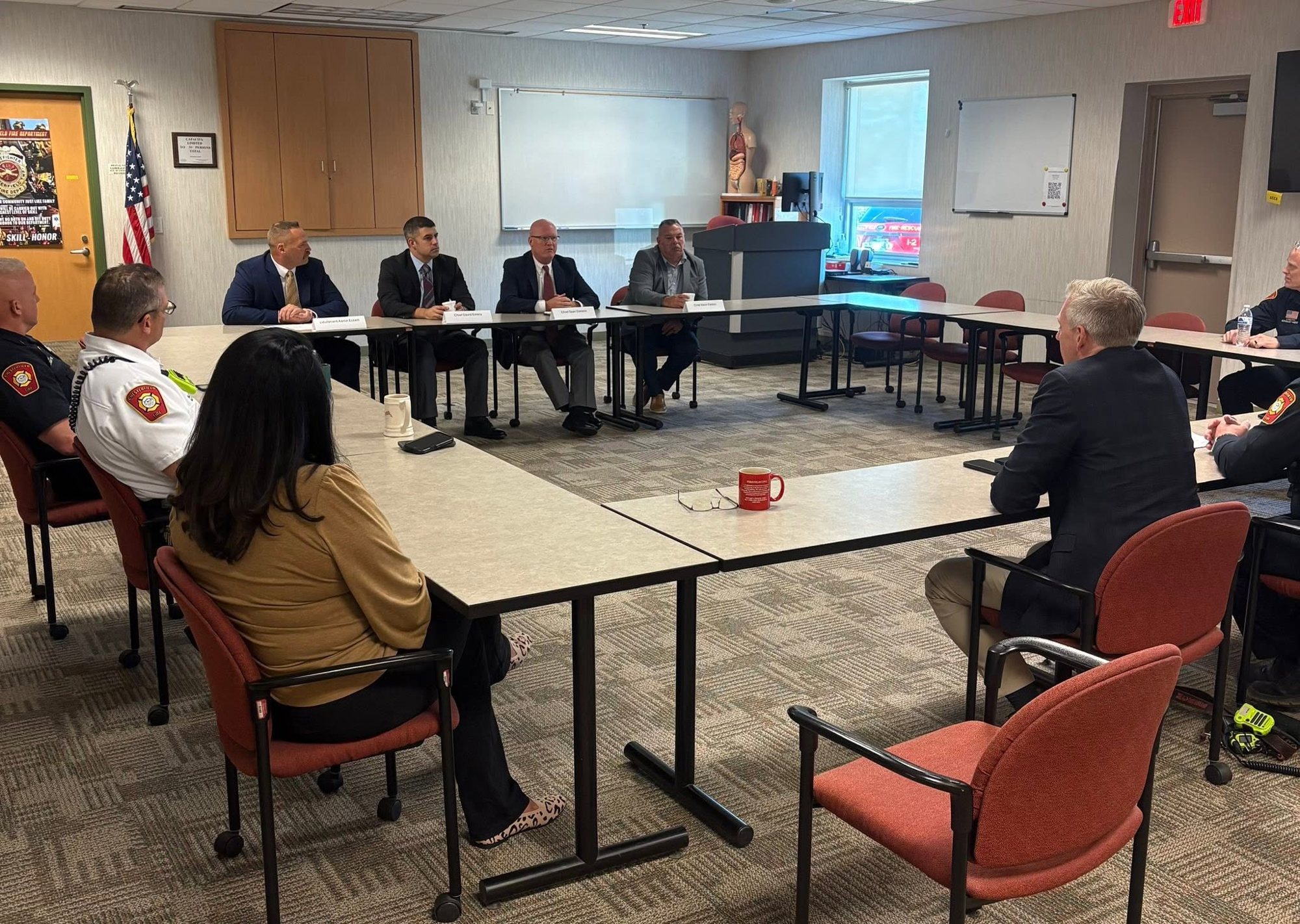 The CFAI peer assessment team meeting with department and township leaders at Fire Station 3