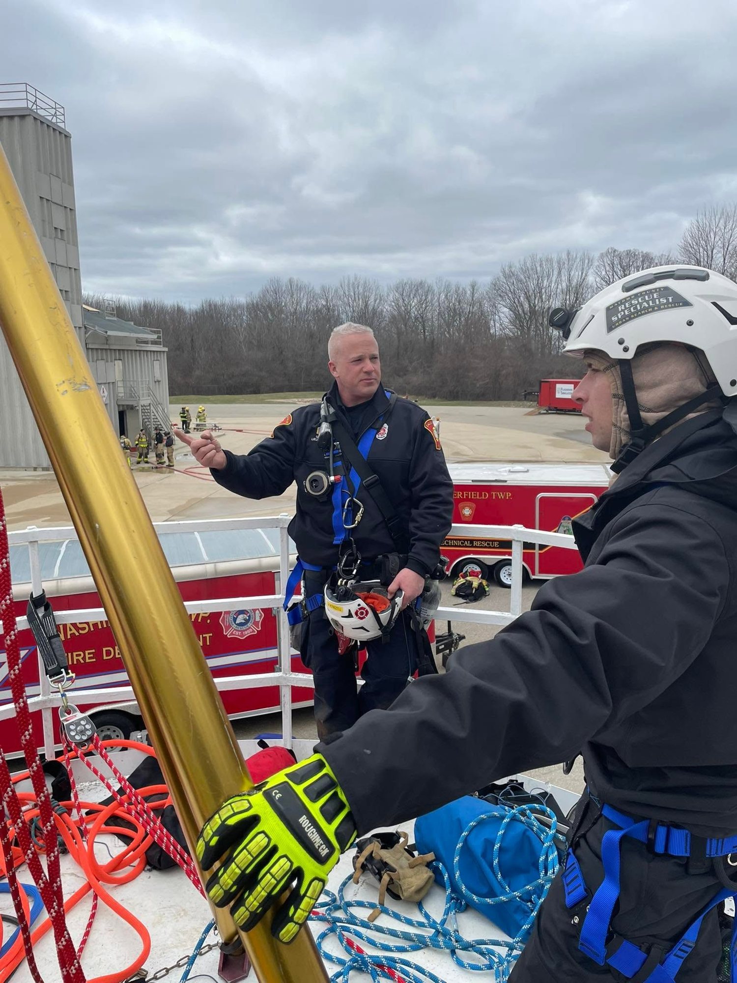 Rescuers preparing rope systems for a confined space entry