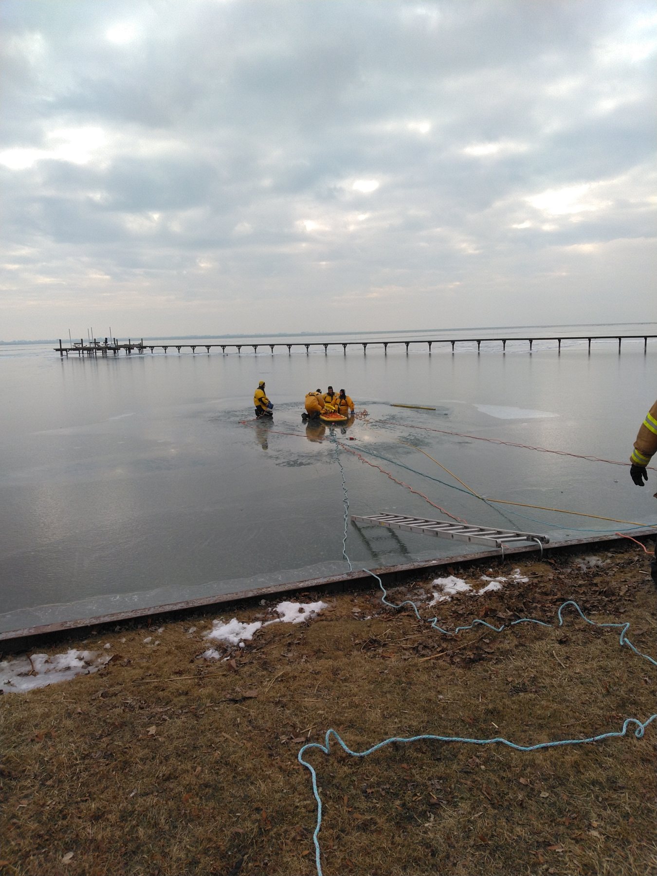 An ice rescue team far out on frozen Lake St. Clair