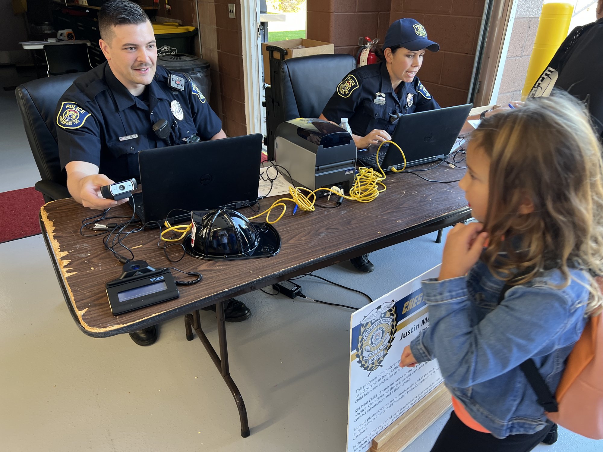 Police officers making kID Print photo IDs for children