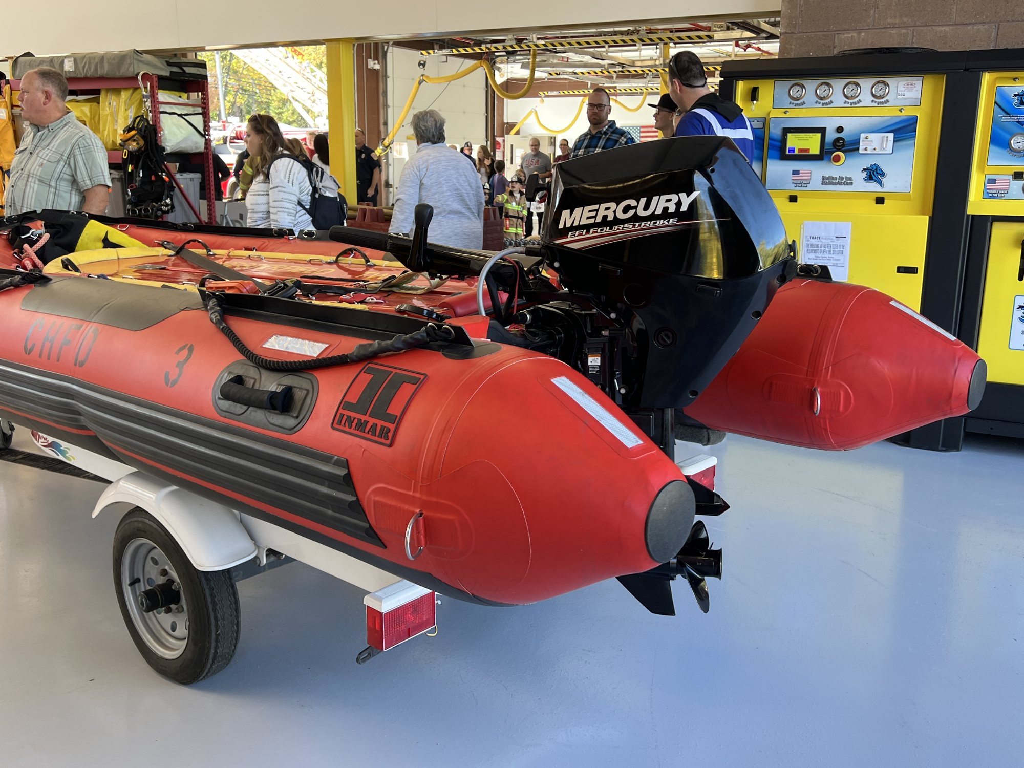 Visitors crowding around the department's inflatable rescue boats