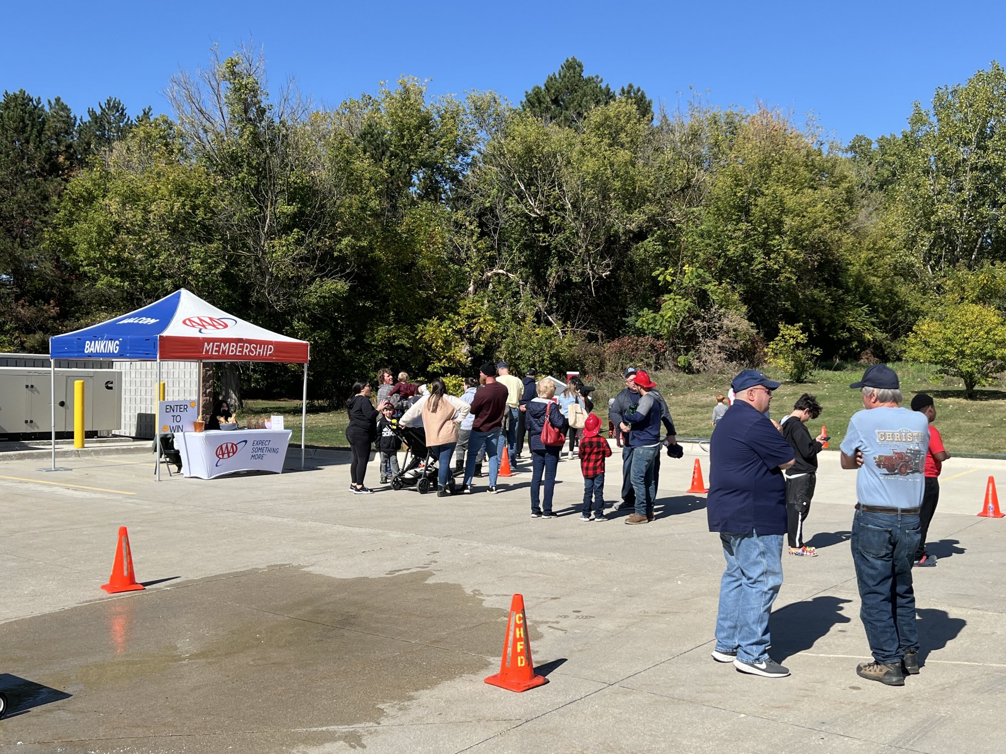 Families visiting the outdoor tents and displays