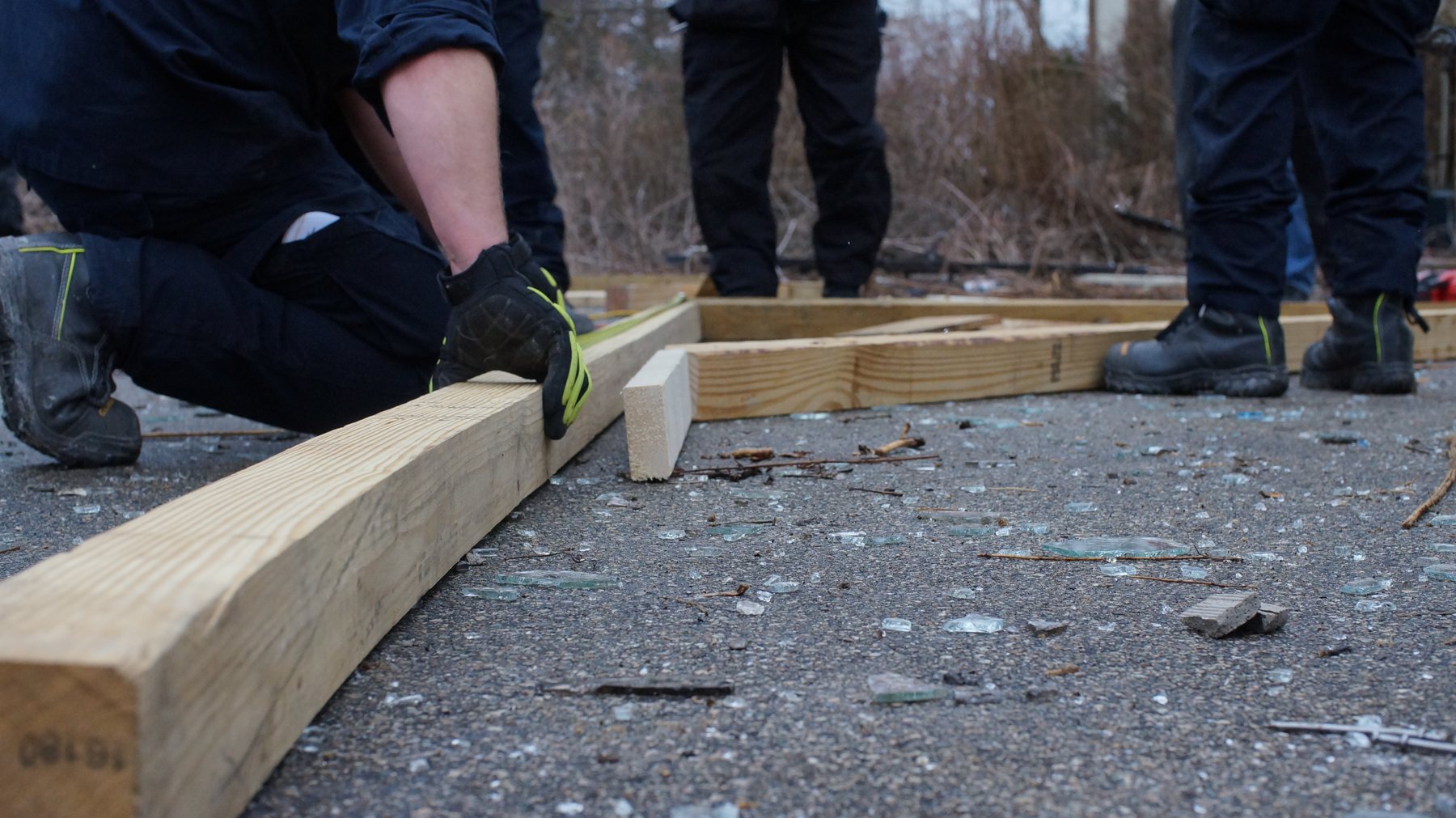 Cutting timber for shoring during collapse training