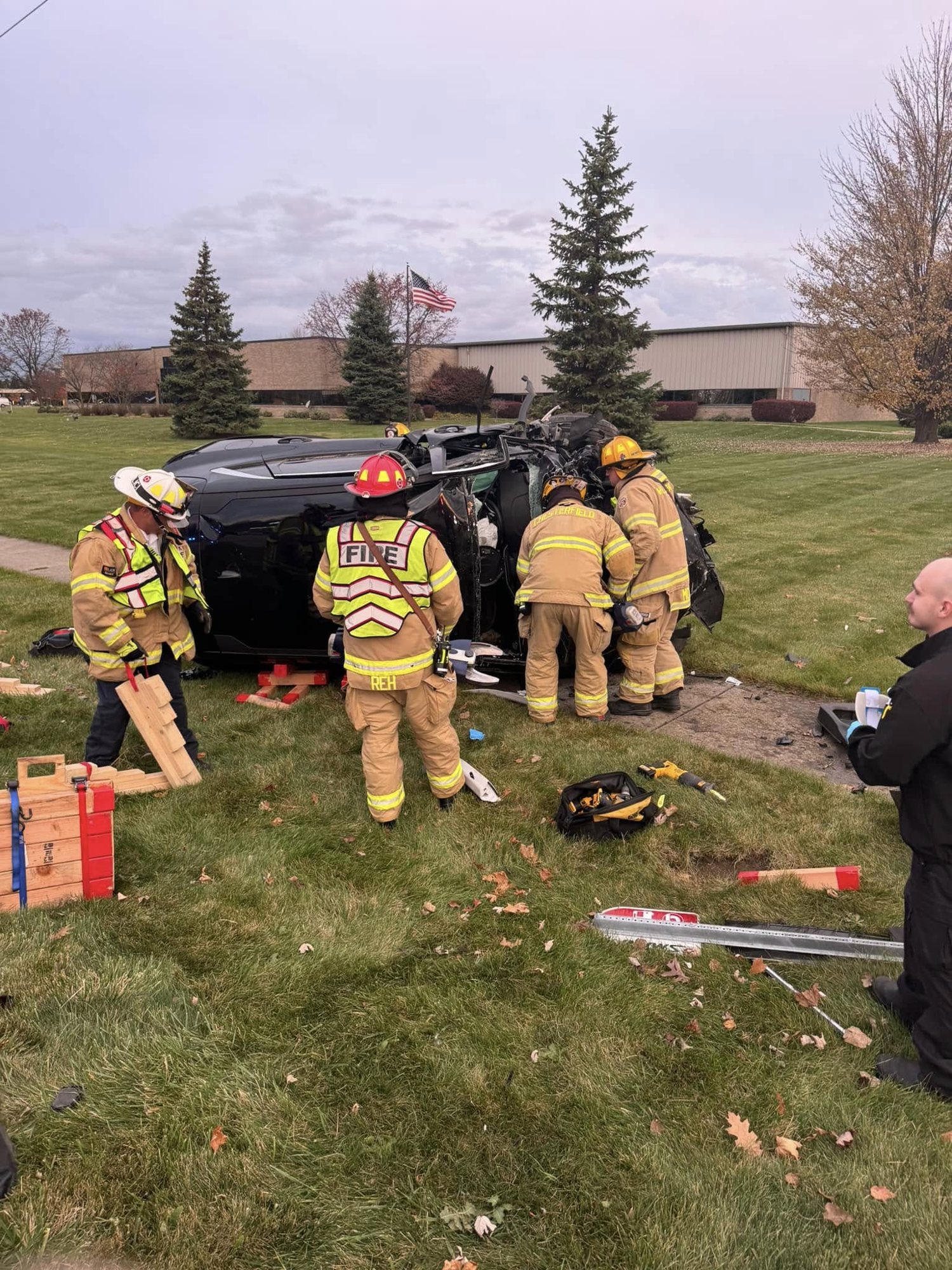 Firefighters working an overturned vehicle
