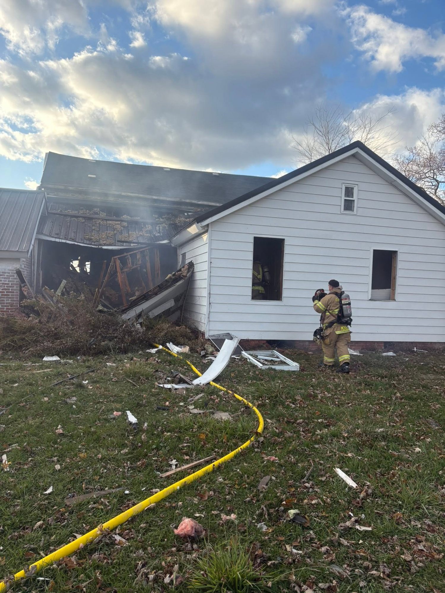 Hose lines stretched to a house fire