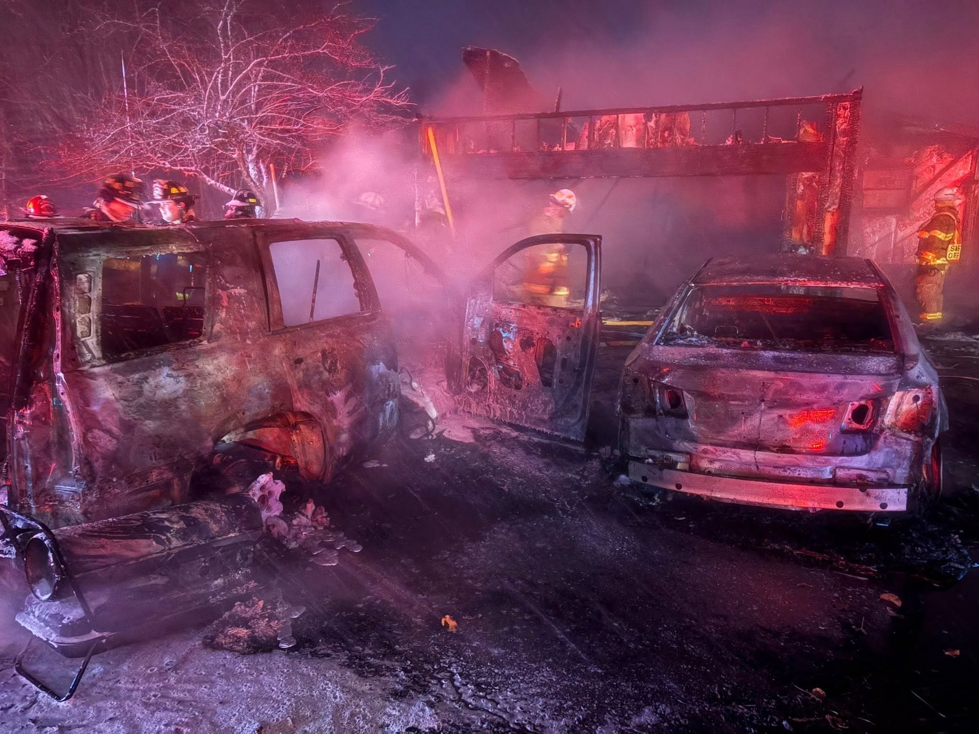 Crews at a vehicle fire at night