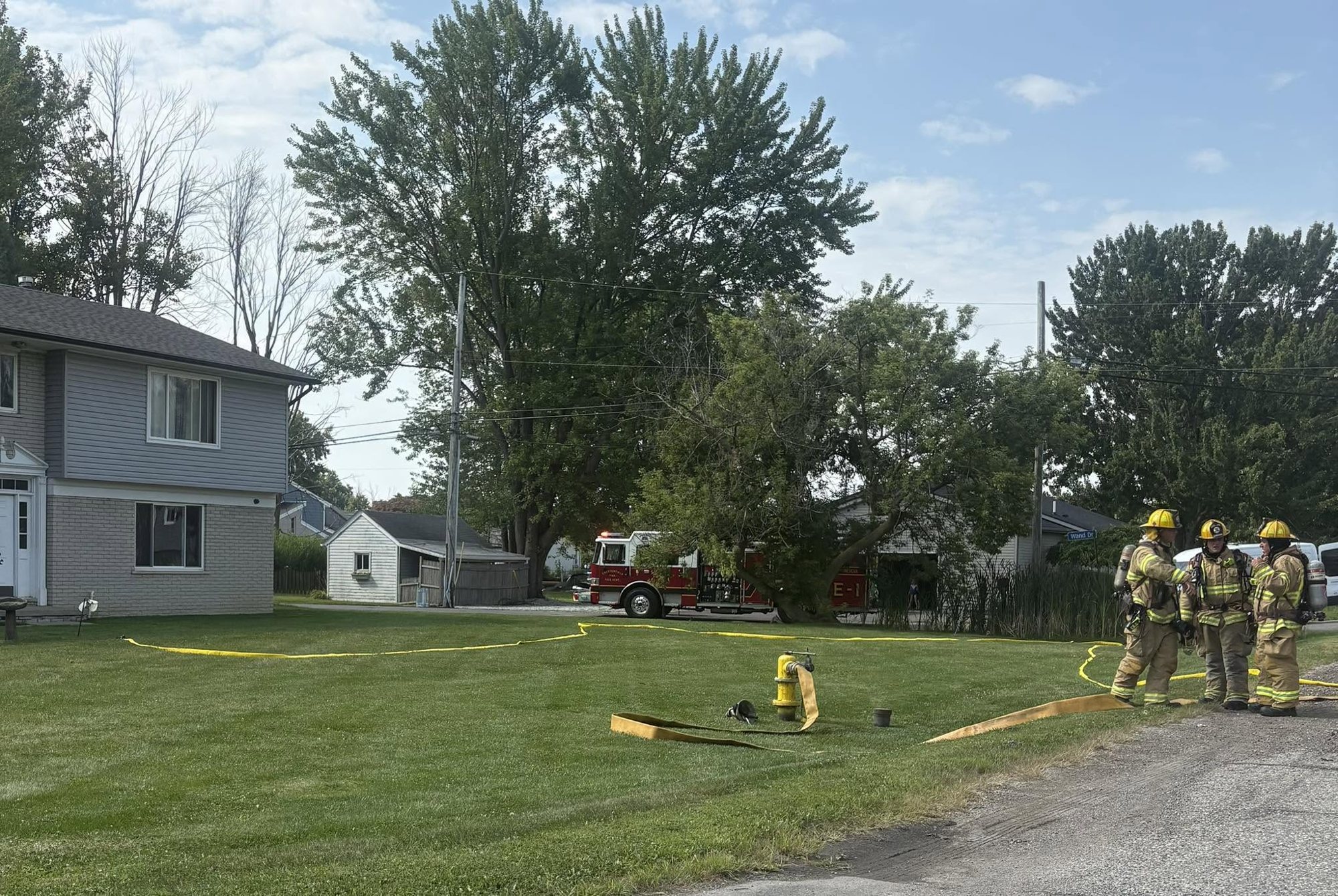 Truck 3 with hose lines at a fire scene