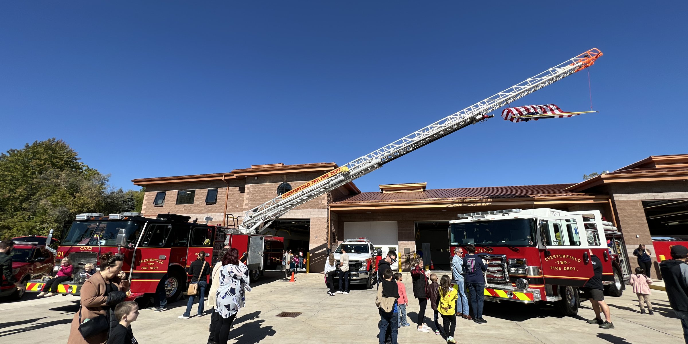 Fire Station 3, department headquarters, with Truck 3's aerial raised and engines out front