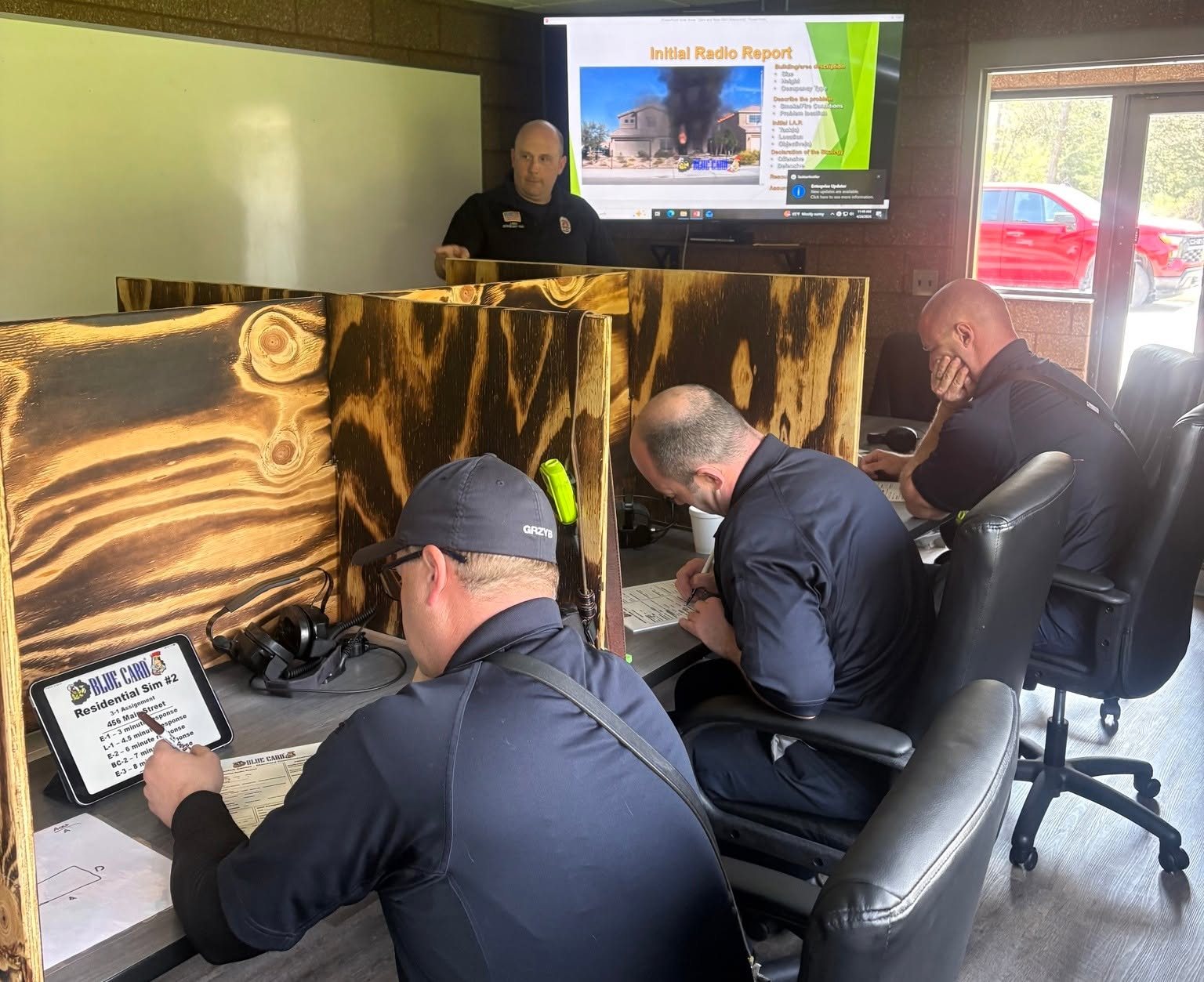 Firefighters working a Blue Card incident command simulation