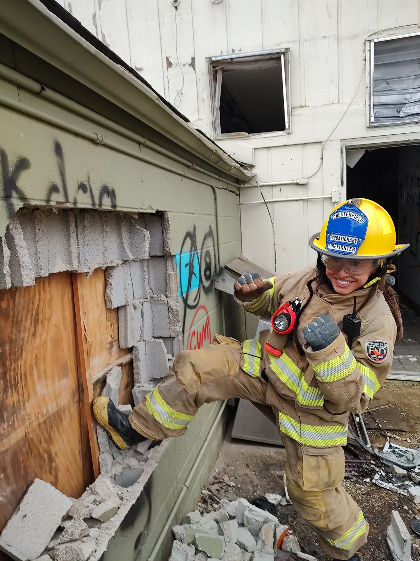A firefighter forcing a door during forcible entry training