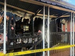 The burned porch of the mobile home on Au Lac Drive North