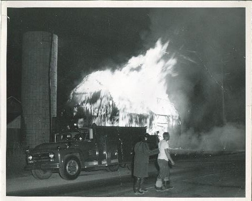 An early Chesterfield Township fire engine at a night barn fire