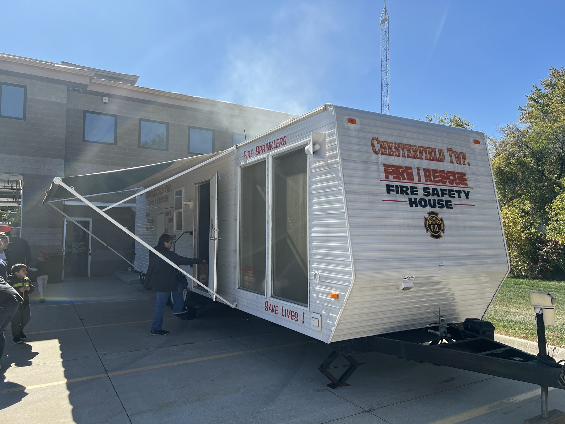 Visitors touring the Chesterfield Township Fire Safety House trailer