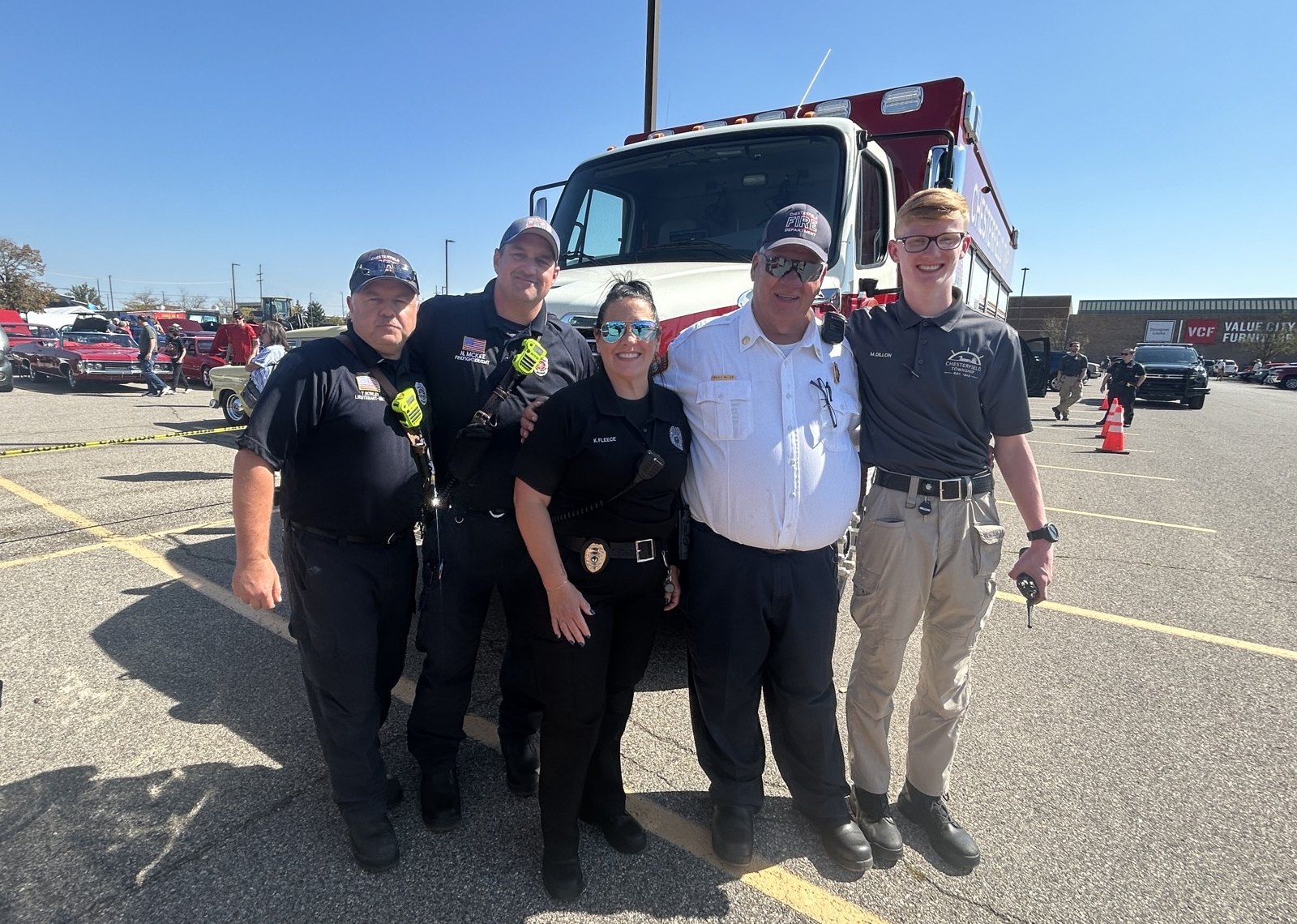 Chaplain Kim Fleece with Chesterfield firefighters, Fire Chief Craig Miller and a cadet in front of a fire engine at a 2025 community event