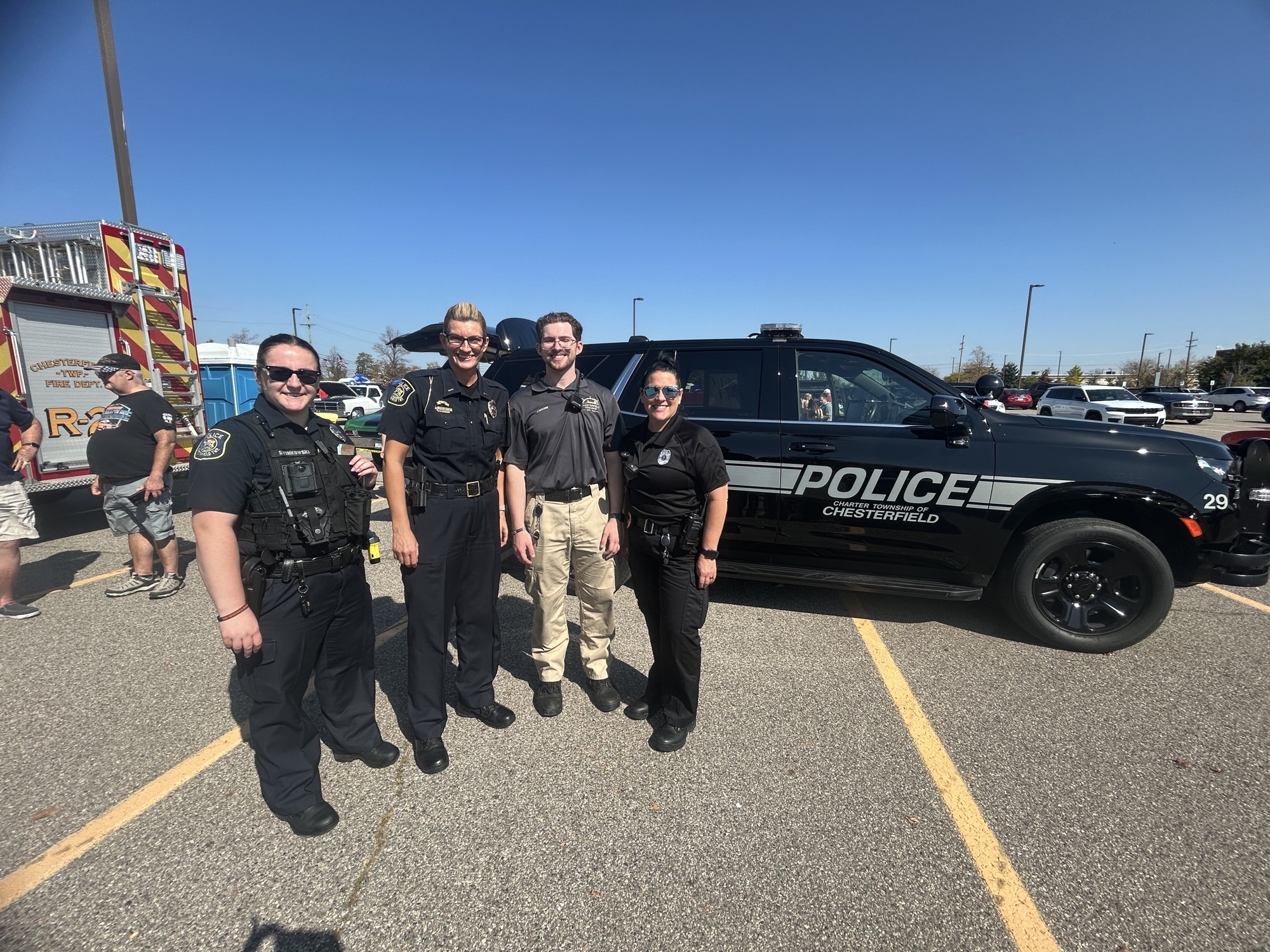 Chaplain Kim Fleece with officers and a cadet at a 2025 community event