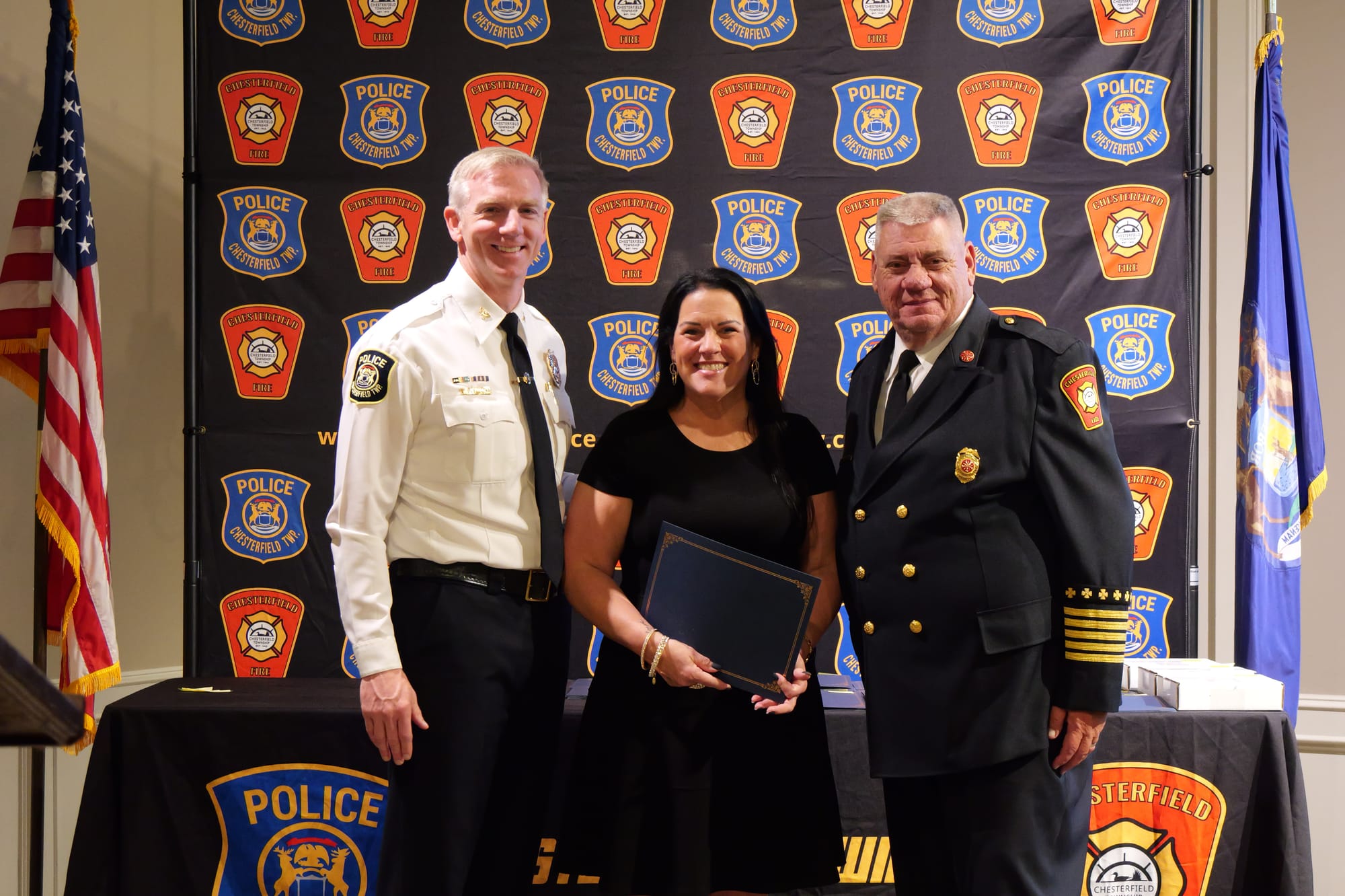 Chaplain Kim Fleece with Director of Public Safety Brian Bassett and Fire Chief Craig Miller at her swearing-in