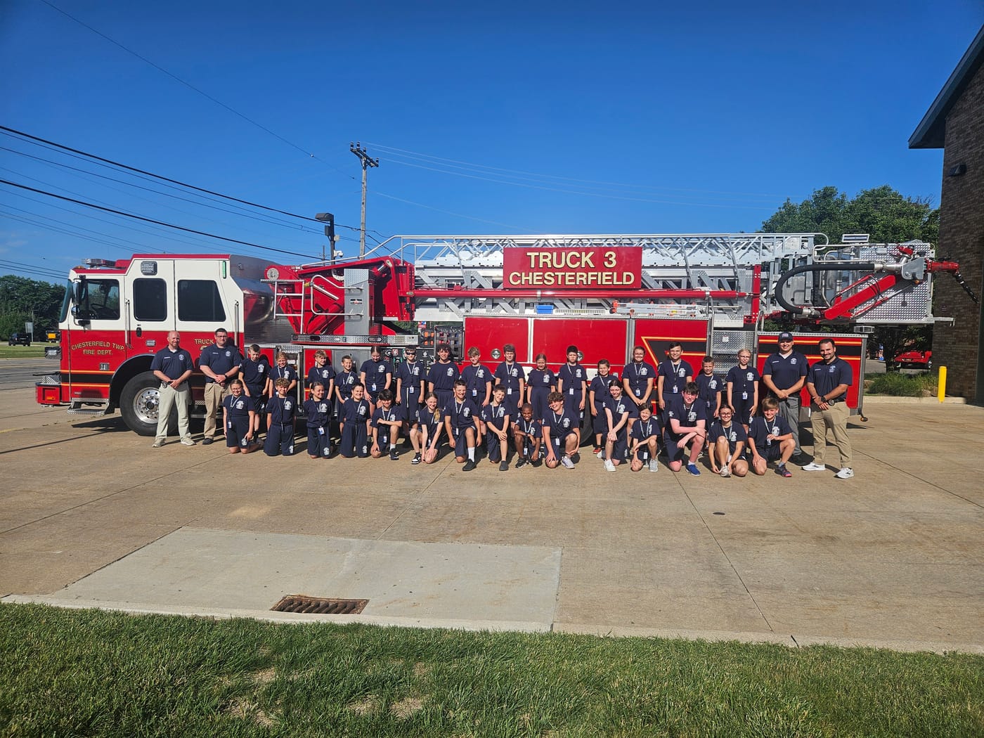 The 2025 Junior Public Safety Academy class with Chesterfield Township Fire Department Truck 3